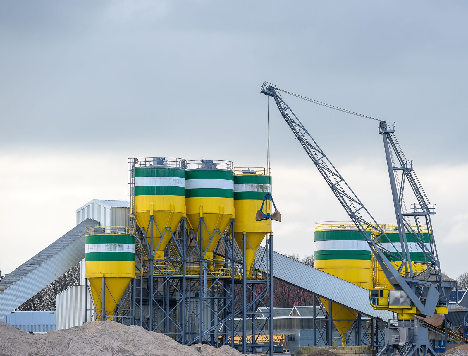Cement silos and a crane at an industrial plant