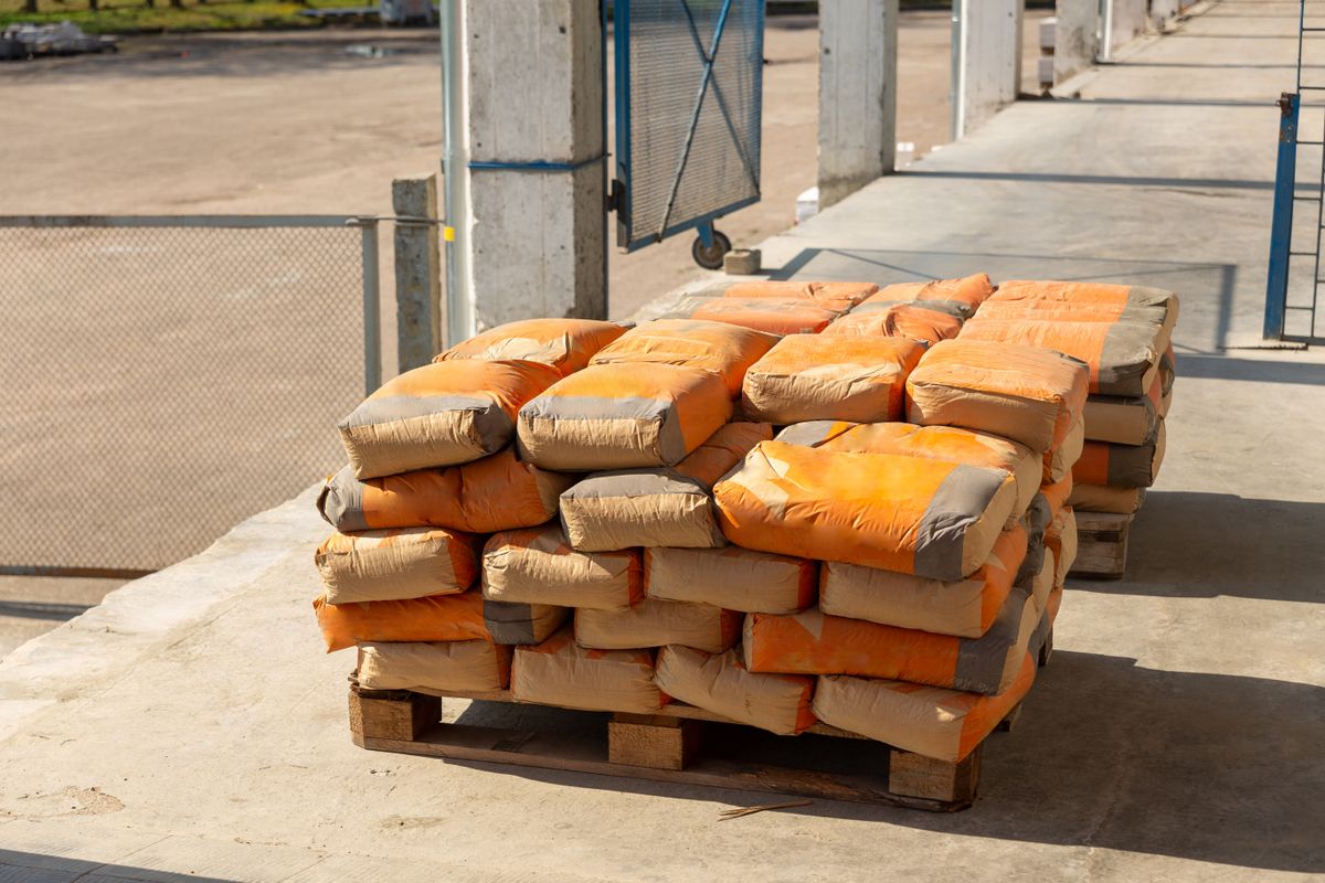 Pallet of cement bags in an industrial yard